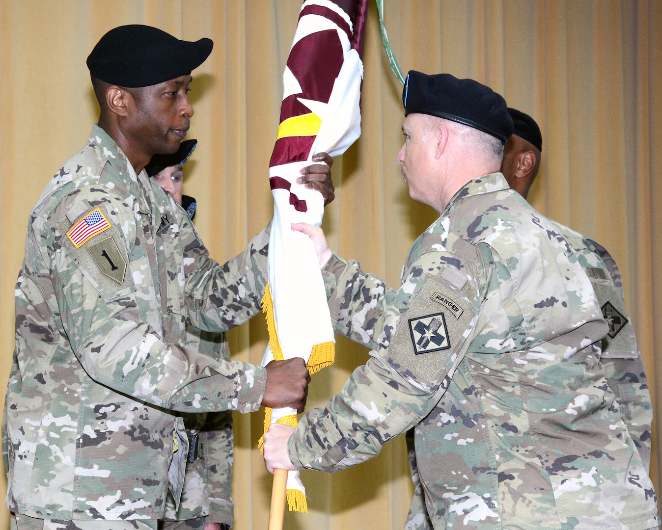 Col. Clinton W. Schreckhise (right), commander, 32nd Medical Brigade, presided over the change of responsibility ceremony as Command Sgt. Maj. Thomas R. Oates relinquished responsibility to Command Sgt. Maj. Carlisie Y. Jones (left) at Blesse Auditorium at the Army Medical Department Center & School at Joint Base San Antonio-Fort Sam Houston May 1. Oates is transitioning to serve as the command sergeant major at Brooke Army Medical Center. Jones comes to the 32nd Medical Brigade from the Medical Professional Training Brigade.