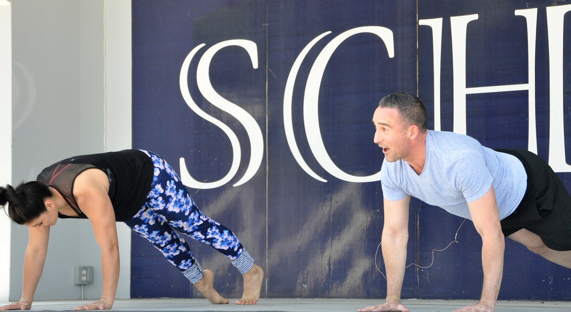 Lt. Col. Thomas Lessner and a co-instructor teach body flow (a hybrid of tai chi, pilates and yoga) during the recent City of Schertz “Movin’ on Main” community health event. (U.S. Air Force photo by Debbie Gildea)