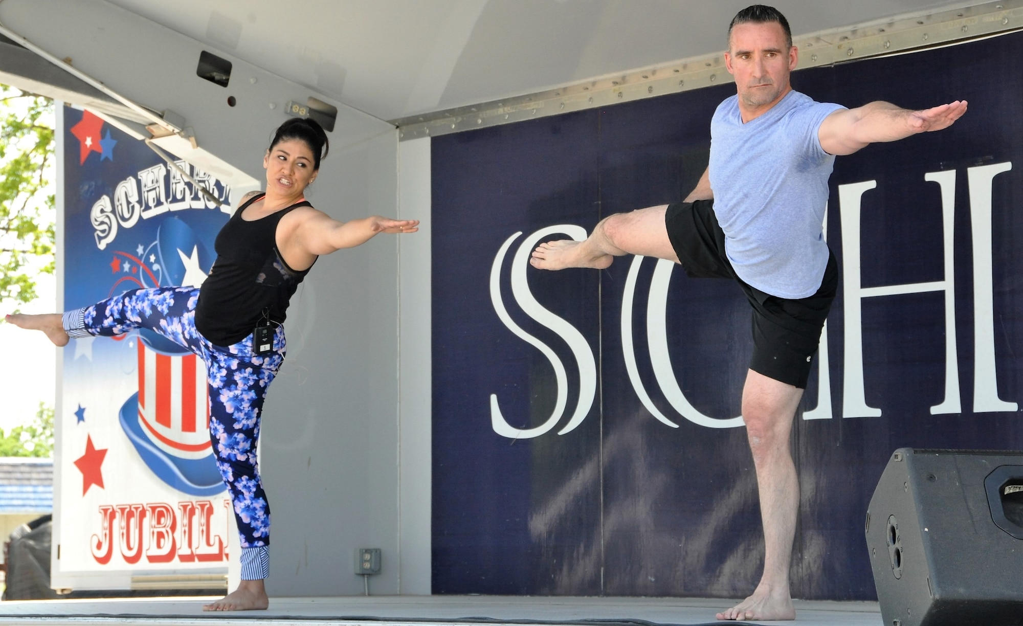 Lt. Col. Thomas Lessner and a co-instructor teach body flow (a hybrid of tai chi, pilates and yoga) during the recent City of Schertz “Movin’ on Main” community health event. (U.S. Air Force photo by Debbie Gildea)