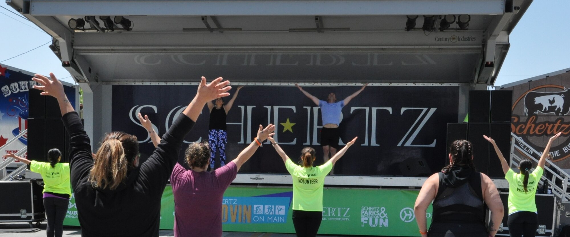 Lt. Col. Thomas Lessner and a co-instructor teach body flow (a hybrid of tai chi, pilates and yoga) during the recent City of Schertz “Movin’ on Main” community health event. (U.S. Air Force photo by Debbie Gildea)