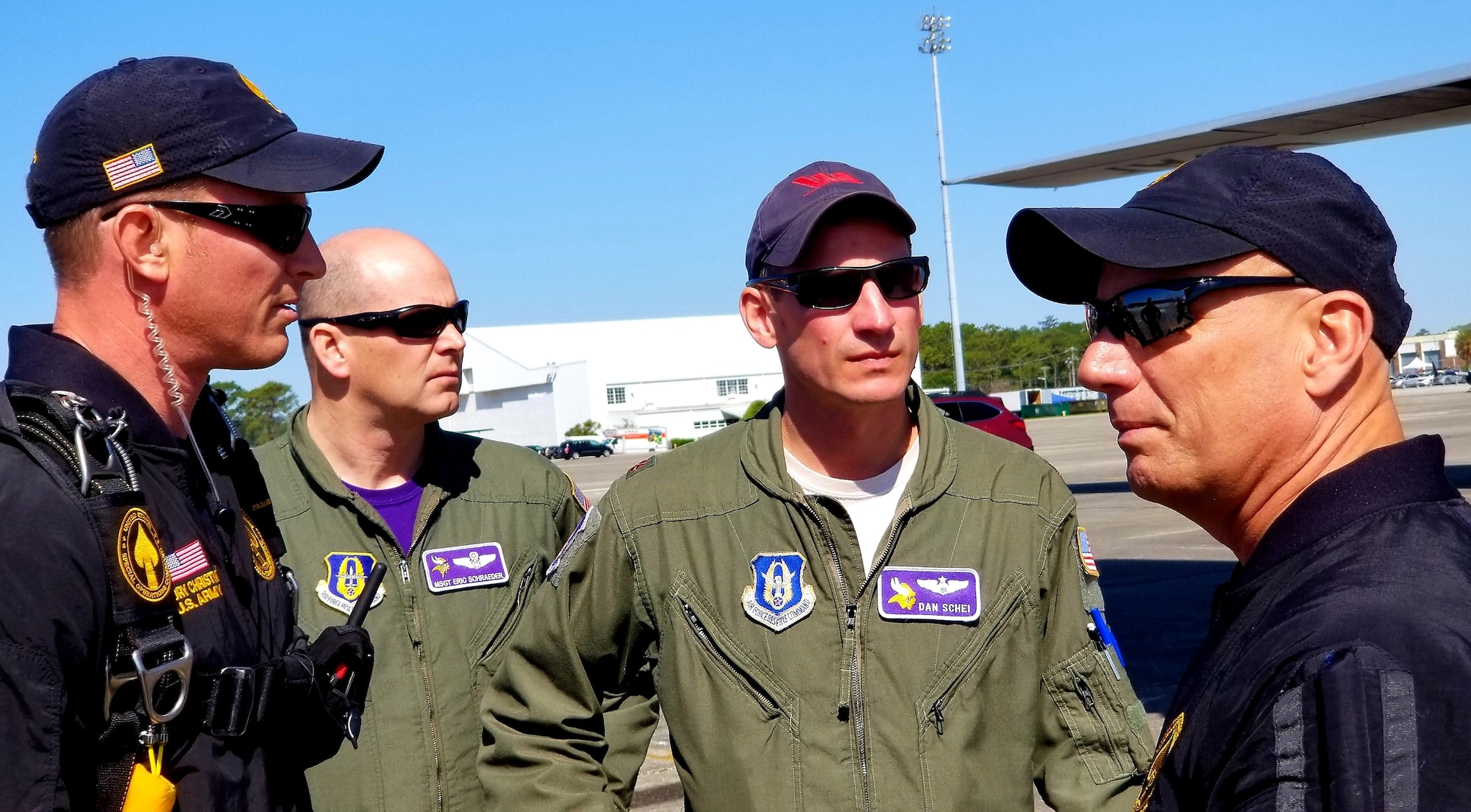 SOCOM Para-Commandos U.S. Army Sgt. 1st Class Cory Christiansen and DoD Parachute Officer Keith Walter brief the jump plan to 934th Airlift Wing loadmaster Master Sgt. Eric Schraeder and pilot Major Dan Schei before the first jump at the Wings Over Myrtle Beach Air Show April 29, 2018. The SOCOM Para-Commandos are the only joint military demonstration team in the DoD; a reserve C-130 from the 934th Airlift Wing, Minneapolis-St. Paul International Airport Air Reserve Station, provided the jump team's airlift at the show. (Air Force Photo/Lt. Col Erin Karl)