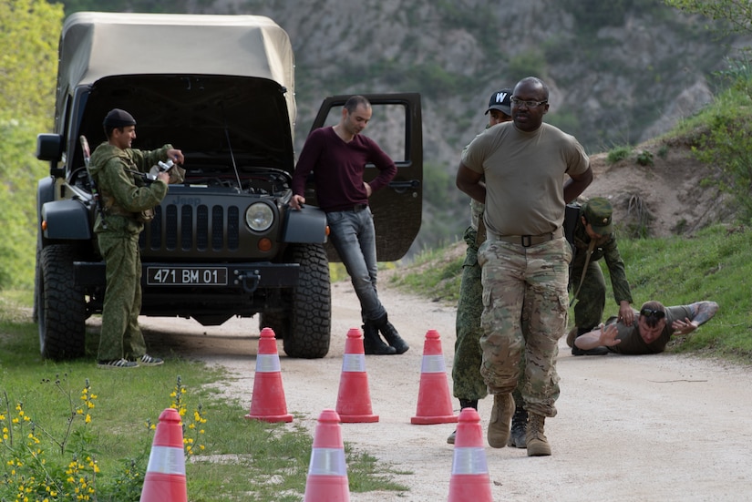 U.S. Soldiers roleplaying as smugglers are taken into custody at a traffic control point at a mountain training camp outside of Dushanbe, Tajikistan, April 24, 2018, during an exercise to exchange tactics between Tajik and U.S. forces. This information exchange was part of a larger military-to-military engagement taking place with the Tajikistan Peacekeeping Battalion of the Mobile Forces and the 648th Military Engagement Team, Georgia Army National Guard, involving border security tactics and techniques.