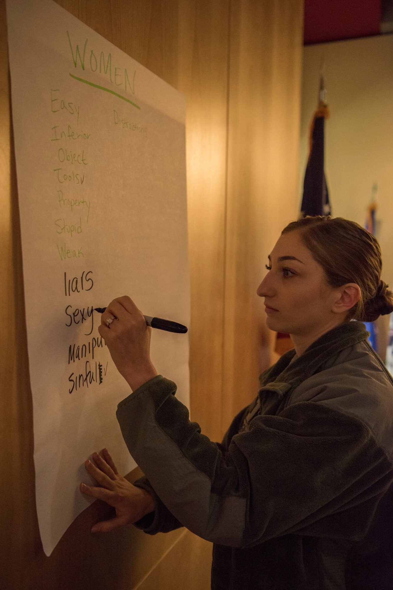 Air Force 1st Lt. Julie Dewey, deputy sexual assault response coordinator, participates in a game during a Sexual Assault Prevention and Response educational opportunity at Joint Base Elmendorf-Richardson, Alaska, April 23, 2018. The guest speaker, We End Violence director Jeffrey Bucholtz, spoke to the audience about sexualized violence and what the community can do to change cultural norms.