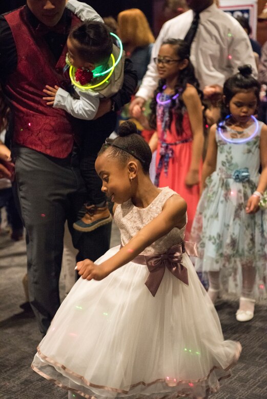 Espe, age 6, daughter of Air Force Staff Sgt. Vaniece Shorter, 673d Medical Operations Squadron neurology technician, dances during the Father/Daughter and Mother/Son Dance at Joint Base Elmendorf-Richardson’s Arctic Warrior Events Center, April 27, 2018. The event was sponsored by the Family Advocacy Program, the Sexual Assault Prevention and Response Office, the 673d Medical Group, and the USO. Attendees had the chance to partake in Information booths, a build-your-own ice cream sundae bar and dancing.