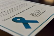 Col. Julian Cheater, 432nd Wing/432nd Air Expeditionary Wing commander, signed a proclamation declaring April 2018 the Sexual Assault Awareness and Prevention Month for Creech Air Force Base, March 21, 2018, at Creech AFB, Nev. The proclamation states that “…together, we can reduce, with the goal to eliminate, sexual assault from the U.S. Air Force.” (U.S. Air Force photo by Airman 1st Class Haley Stevens)