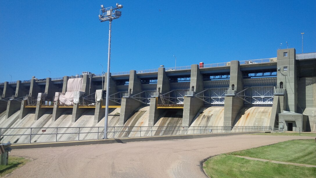 The Harlan County Dam has been repaired. This photo from 2016 shows one stage with a tainter gate shrouded by a tarp as work was being done. A ribbon cutting for the completion of all work on the dam will be held Friday, May 11, 2018 at the Harlan County Lake, near Alma, Neb., at the North Outlet Park at 11:00 a.m. Contributed photo.