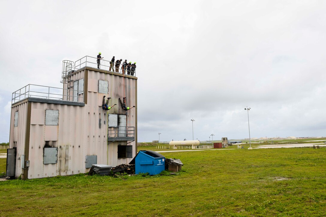 Republic of Korea Air Force Senior Master Sgt. Chae Hyun Ae takes instruction from Master Sgt. Jason Layfield, 554th Redhorse Squadron Fire Emergency Services Contingency Training section chief, during rappelling training April 21, 2018, at Andersen Air Base, Guam. The training took part during Theater Security Cooperative Silver Flag training, a week-long exercise that that included Airmen from the U.S., Republic of Korea, Singapore, and Australia. (U.S. Air Force photo by Tech. Sgt. Jake Barreiro)
