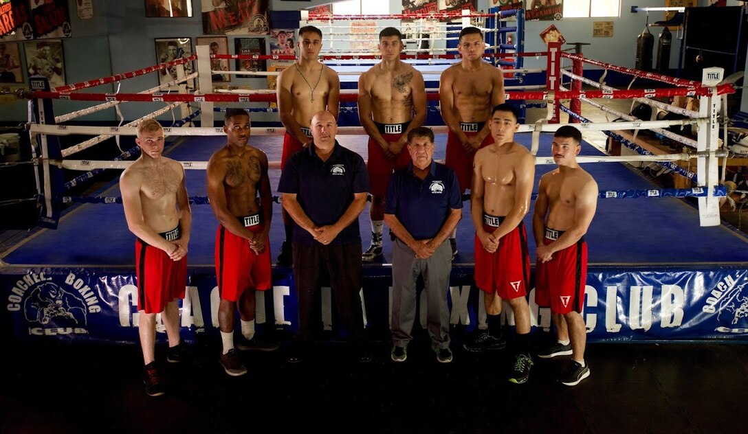 1st Marine Division Boxing Team poses for a group photo after a training session in Coachella, Calif.