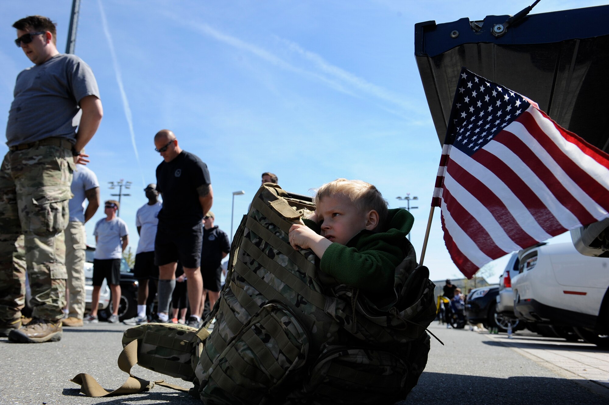 Tactical Air Control Party Airmen and their families from across Europe take a moment of silence during the 7th Annual TACP 24-hour Run Challenge at U.S. Army Garrison Bavaria, Germany, April 27, 2018. Participants ran to memorialize fallen Airmen and Soldiers, as well as build comradery and raise money to provide support and financial assistance to the fallen and injured members and their families. (U.S. Air Force photo by Senior Airman Savannah L. Waters)