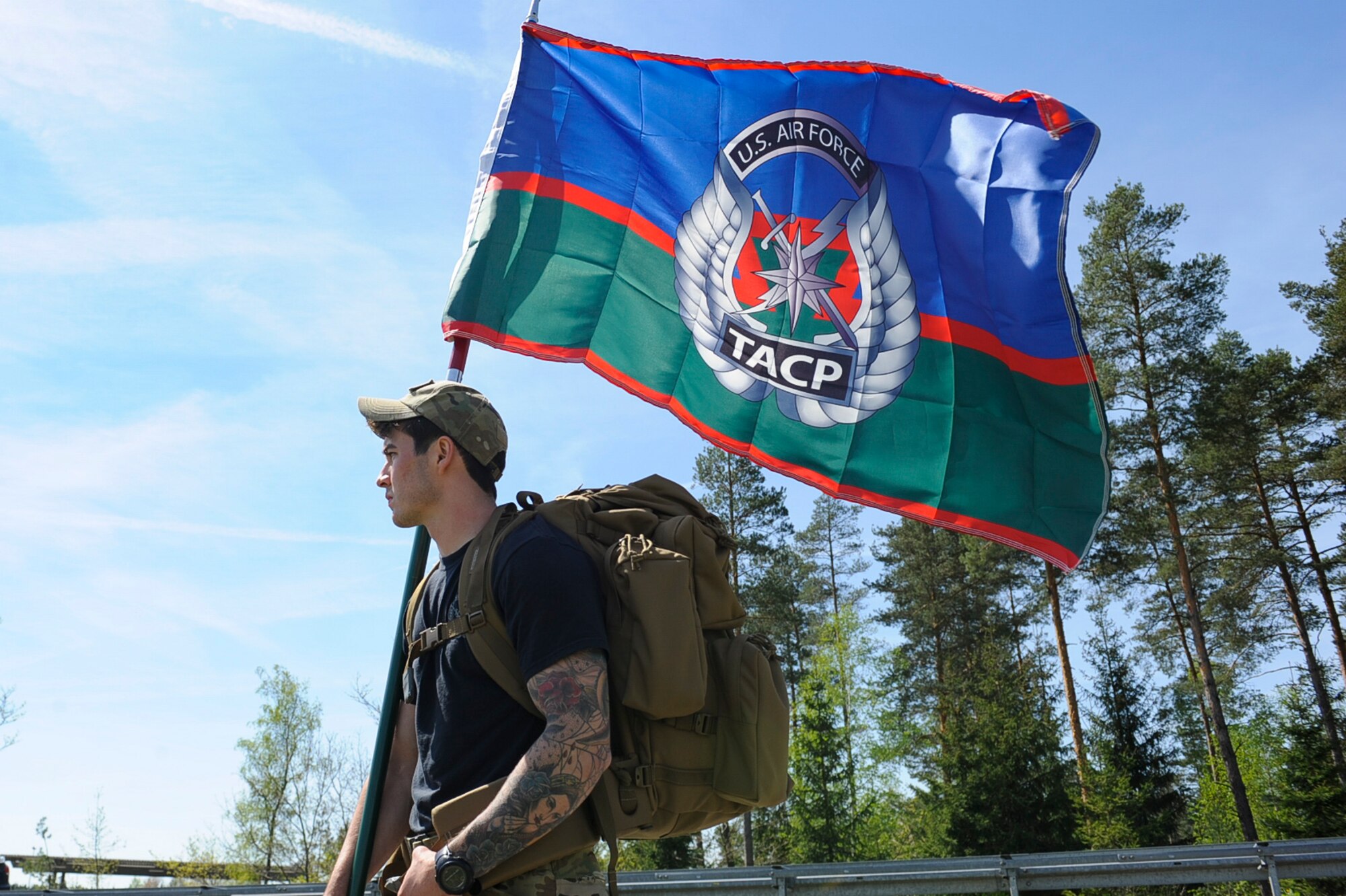 A Tactical Air Control Party Airman holds a U.S. Air Force TACP flag during the 7th Annual TACP 24-hour Run Challenge at U.S. Army Garrison Bavaria, Germany, April 27, 2018. This year, the 2nd Air Support Operations Squadron’s run challenge at USAG Bavaria raised $2,585 to provide support and financial assistance to the fallen and injured members and their families. (U.S. Air Force photo by Senior Airman Savannah L. Waters)