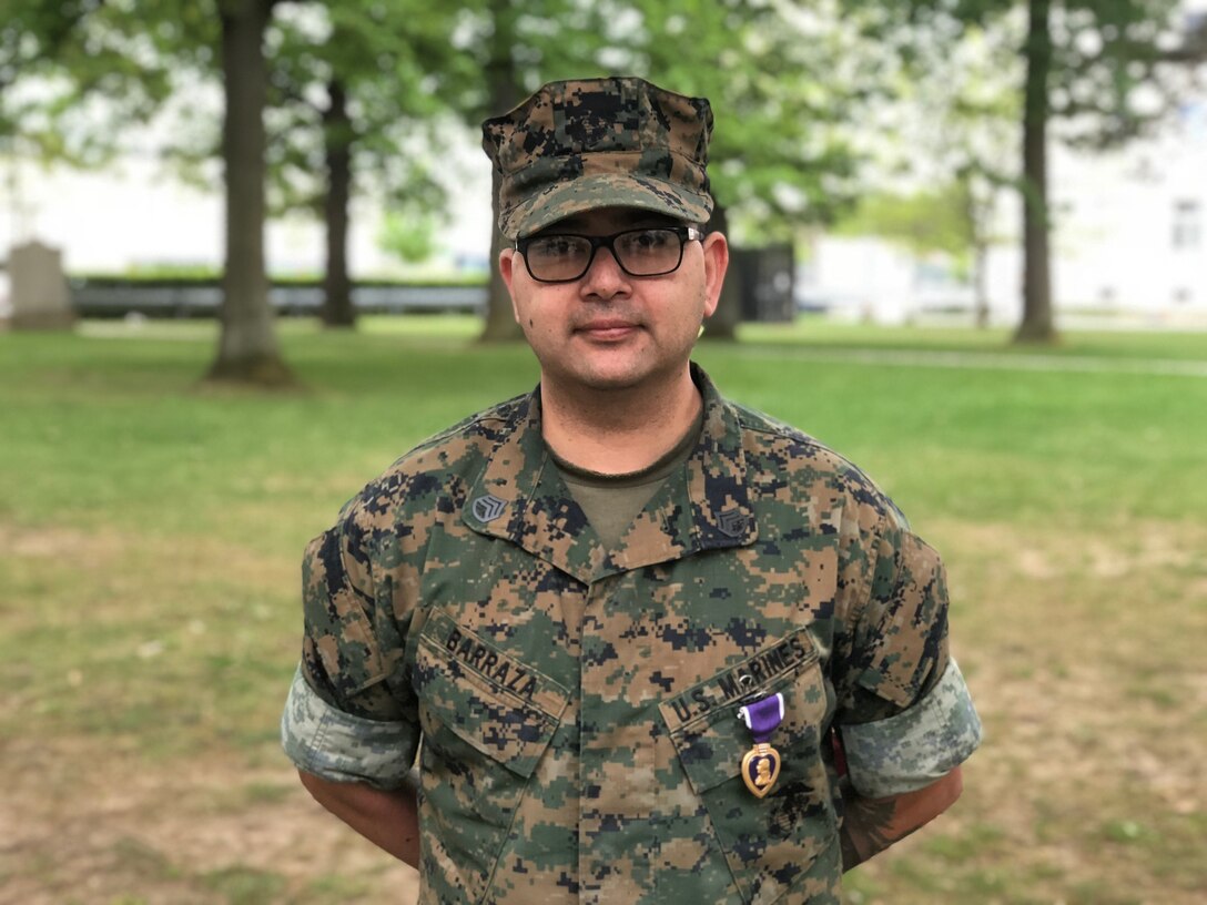 U.S. Marine Corps Staff Sgt. Humberto Barazza, a watch chief receives the Purple Heart ribbon, with Marine Forces Europe and Africa on May 1, 2018. Barazza was awarded the ribbon after sustaining injuries in Afghanistan June 2010