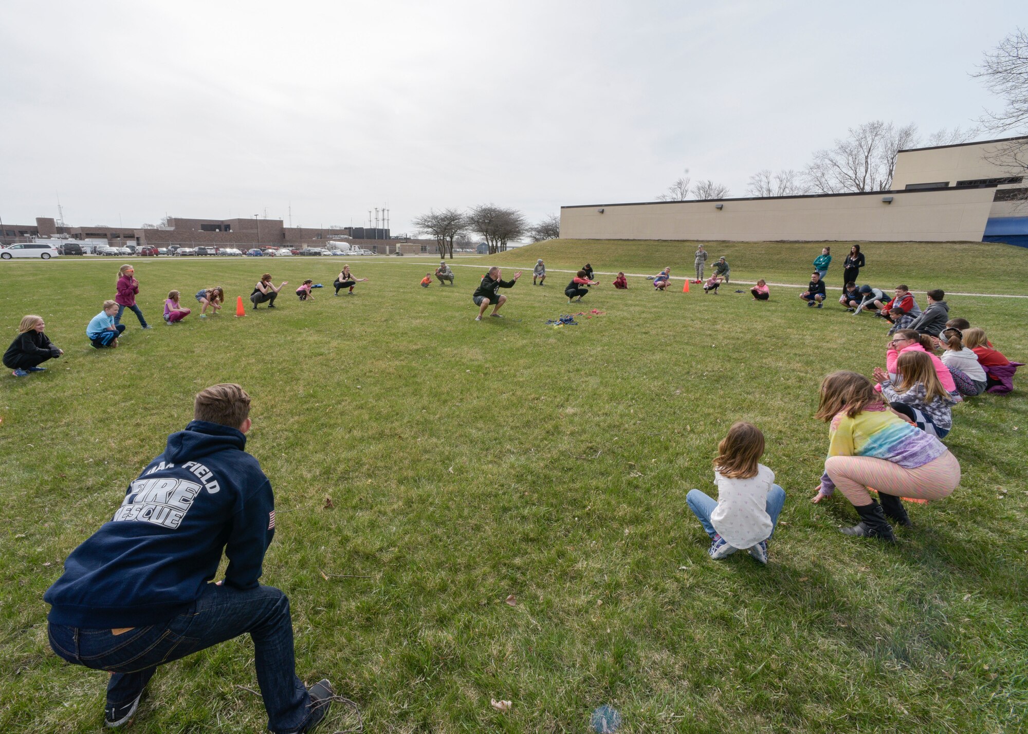 Chief Master Sgt. Chris Lemke, the security forces manager for the 115th Security Forces Squadron, holds a CrossFiti class at Truax Field, Wis. for kids on National Take Our Daughters and Sons to Work Day April 26, 2018. Crossfit was one of many events that took place on Truax Field to show kids how their parents have to stay in good physical shape as part of their job.
(U.S. Air National Guard photo by Cameron R. Lewis)
