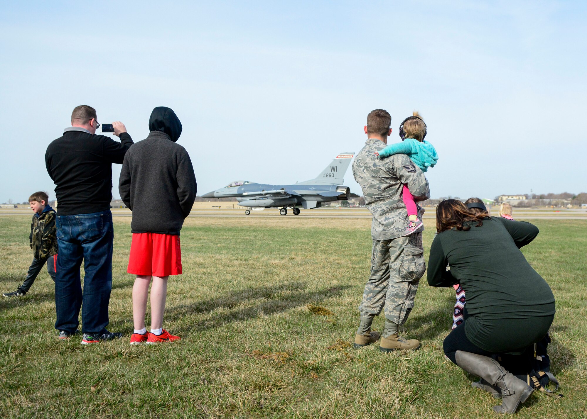 Airmen and their families watch as an F-16 Fighting Falcon prepares for takeoff April 26, 2018 at Truax Field, Wis. This was one of many demonstrations put on by the 115th Fighter Wing for National Take Our Daughters and Sons to Work Day.
(U.S. Air National Guard photo by Mary Greenwood)