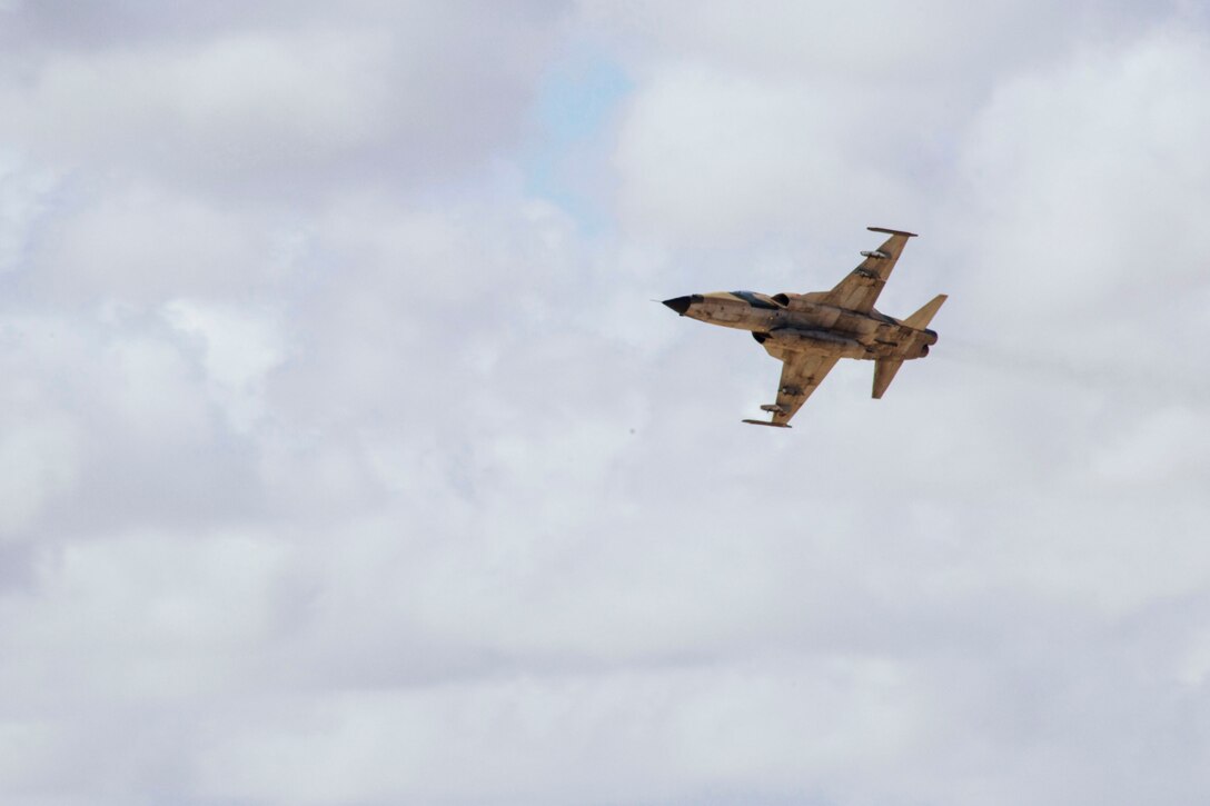 A Moroccan F5 aircraft provides close air support during Exercise African Lion 2018 in Tan Tan, Morocco, April 23, 2018. African Lion is an annual, multinational, joint-force exercise improving interoperability between participating nations. (U.S. Marine Corps photo by Lance Cpl Tessa D. Watts)