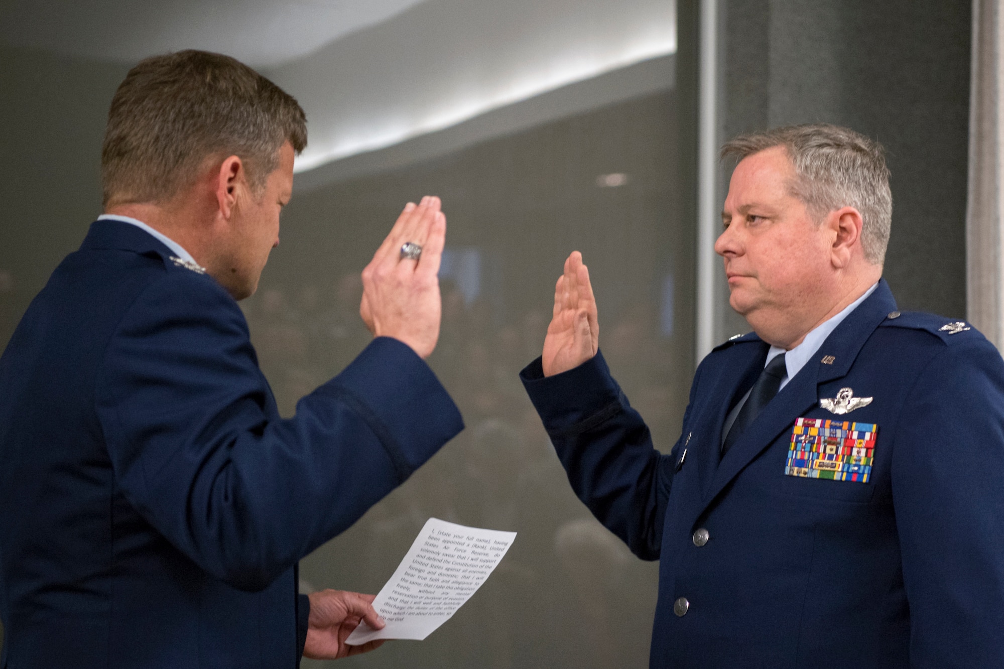 Col. Paul Gates, 434th Air Refueling Wing vice commander, left, administers the oath of office to Col. Brian Hollis, 434th Operational Support Squadron commander, during Hollis’ promotion ceremony at Grissom Air Reserve Base, Ind., April 7, 2018. Hollis is among one percent of Air Force officers who make the rank of colonel during their military career. (U.S. Air Force photo/Tech. Sgt. Benjamin Mota)