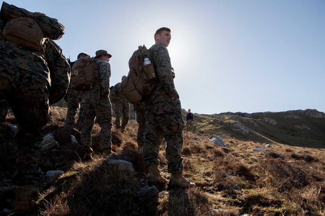 Sgt. Michael Peers, a firepower control team chief with 4th Air Naval Gunfire Liaison Company, Force Headquarters Group, pauses to check which direction his FCT plan on going during a land navigation exercise, in Durness, Scotland, April 30, 2018. 4th ANGLICO is in Scotland to take part in Joint Warrior 18-1, an exercise that furthers their readiness and effectiveness in combined arms integration, small unit tactics and land navigation. This training aims at improving their capabilities and combat effectiveness and ensures they're ready to fight tonight.
