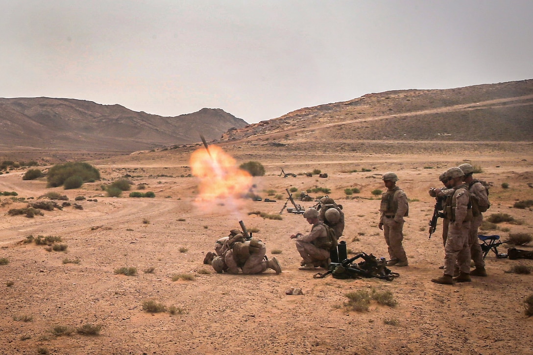 Marines fire an M224A1 60 mm mortar system.