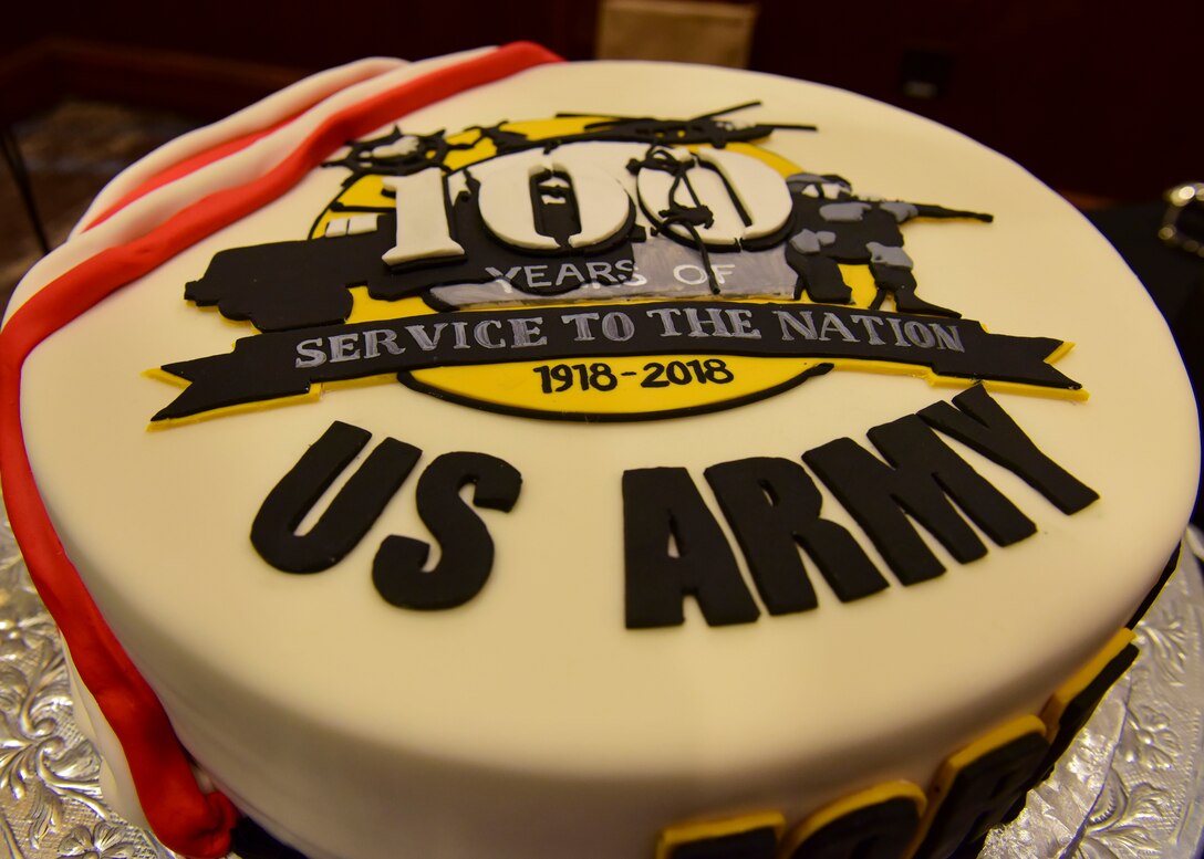 A cake is placed on a display at the Fort Eustis 100th Anniversary Gala in Newport News, Virginia, April 28, 2018. Service members, family members and local officials gathered to celebrate the history and partnership between the installation and the community. (U.S. Air Force photo by Airman 1st Class Monica Roybal)