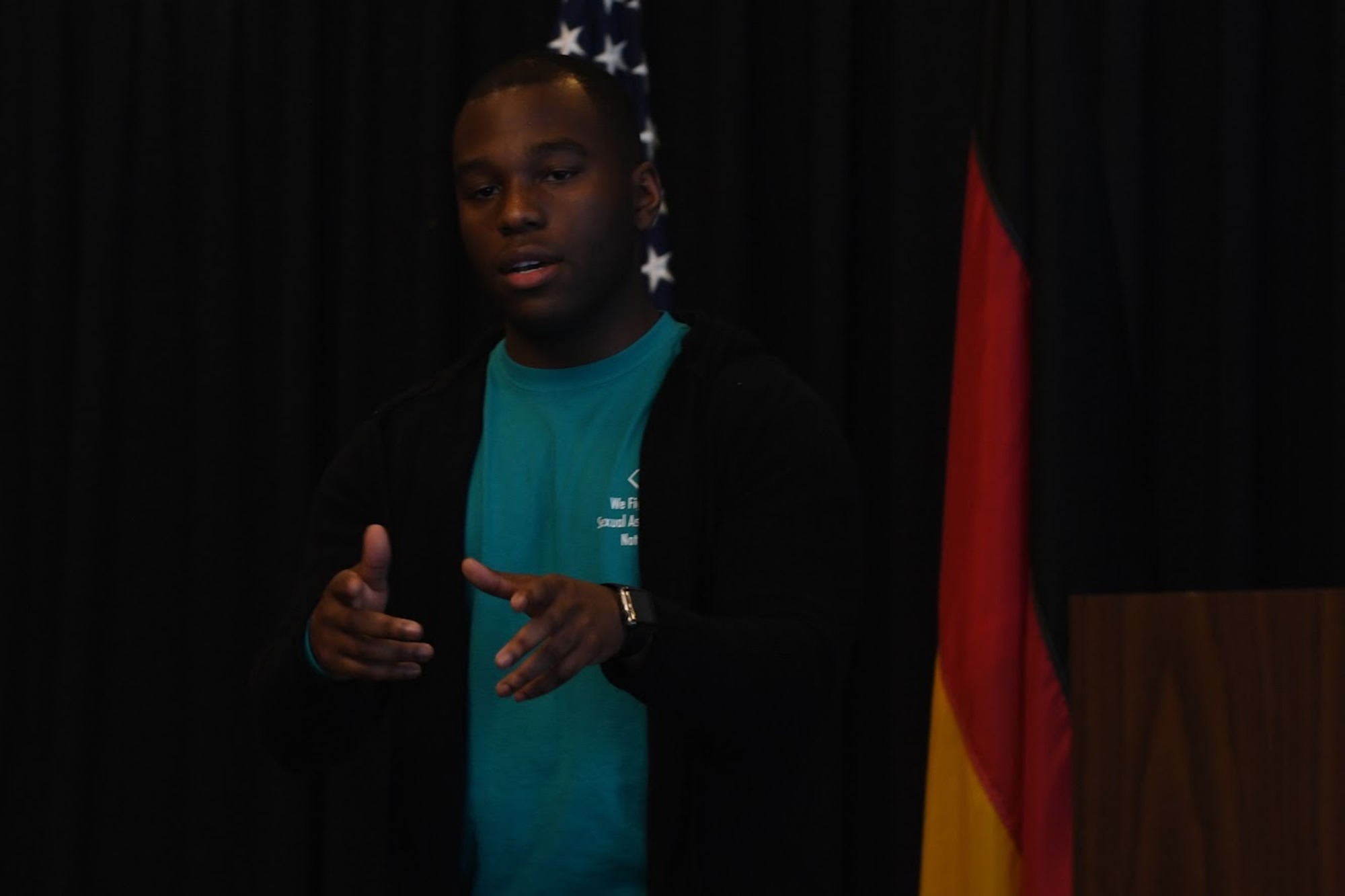 U.S. Air Force Staff Sgt. George Linen, 786th Civil Engineer Squadron electrical systems supervisor and sexual assault survivor, performs an original poem called “Speak” during the Sexual Assault Prevention and Response Leadership Breakfast at Ramstein Air Base, April 12, 2018.