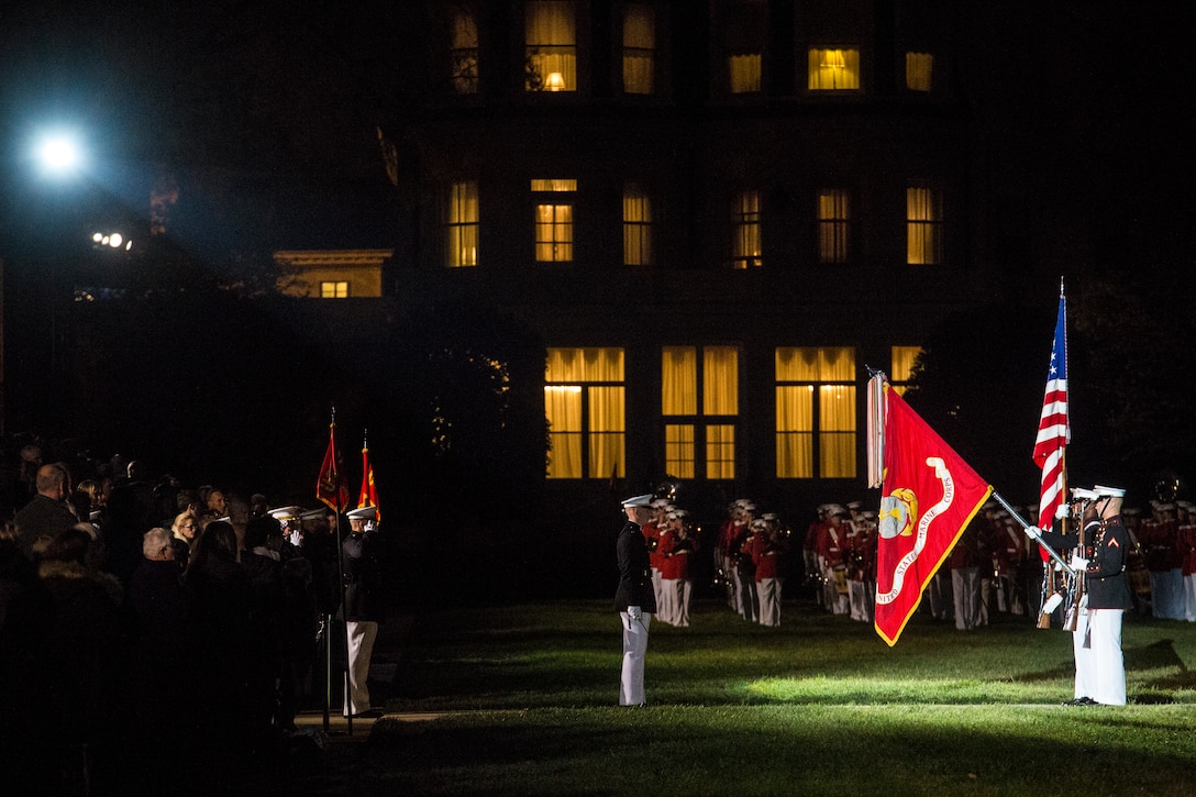 The U.S. Marine Corps Color Guard dips the U.S. Marine Corps Battle Colors during the National Anthem at a Friends and Family Ceremony at Marine Barracks Washington D.C., April 27, 2018. The guest of honor for the parade was the Commandant of the Marine Corps Gen. Robert B. Neller, and the hosting official was the Barracks’ Commanding Officer Col. Tyler J. Zagurski. (Marine Corps photo by Pfc. James Bourgeois/Released)