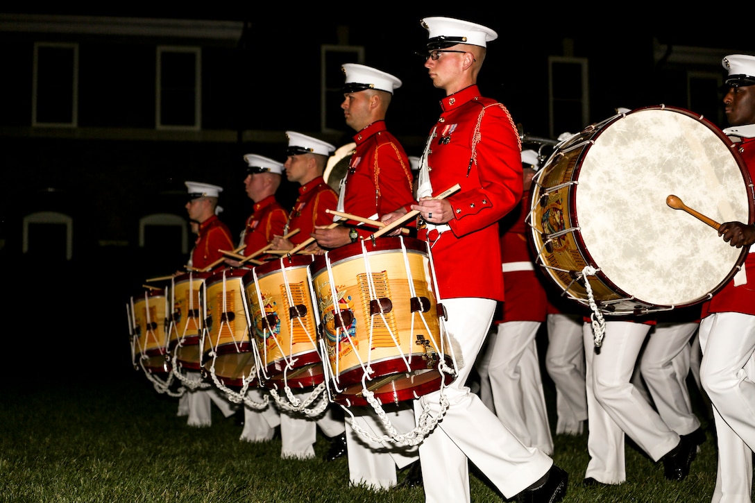 “The Commandant’s Own” U.S. Marine Drum & Bugle Corps marches across the parade field during a Friends and Family Ceremony at the Barracks, Apr. 27, 2018. The guest of honor for the parade was the Commandant of the Marine Corps Gen. Robert B. Neller and the hosting official was the Marine Barracks Washington D.C. Commanding Officer, Col. Tyler J. Zagurski. (Official Marine Corps photo by Cpl. Damon Mclean/Released)