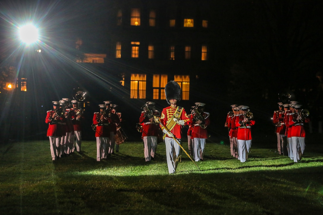 Marines with “The President’s Own” U.S. Marine Band march across the parade field during a Friends and Family Ceremony at Marine Barracks Washington D.C., Apr. 27, 2018. The guest of honor for the parade was the Commandant of the Marine Corps Gen. Robert B. Neller and the hosting official was the Marine Barracks Washington D.C. Commanding Officer Col. Tyler J. Zagurski. (Official Marine Corps photo by Cpl. Damon Mclean/Released)