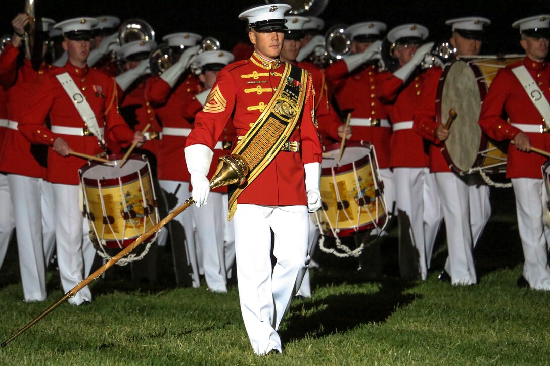 Master Sgt. Keith Martinez, drum major, “The Commandant’s Own” U.S. Marine Drum & Bugle Corps, leads the D&B across the parade field during a Friends and Family Ceremony at Marine Barracks Washington D.C., Apr. 27, 2018. The guest of honor for the parade was the Commandant of the Marine Corps Gen. Robert B. Neller and the hosting official was the Marine Barracks Washington D.C. Commanding Officer Col. Tyler J. Zagurski. (Official Marine Corps photo by Cpl. Damon Mclean/Released)