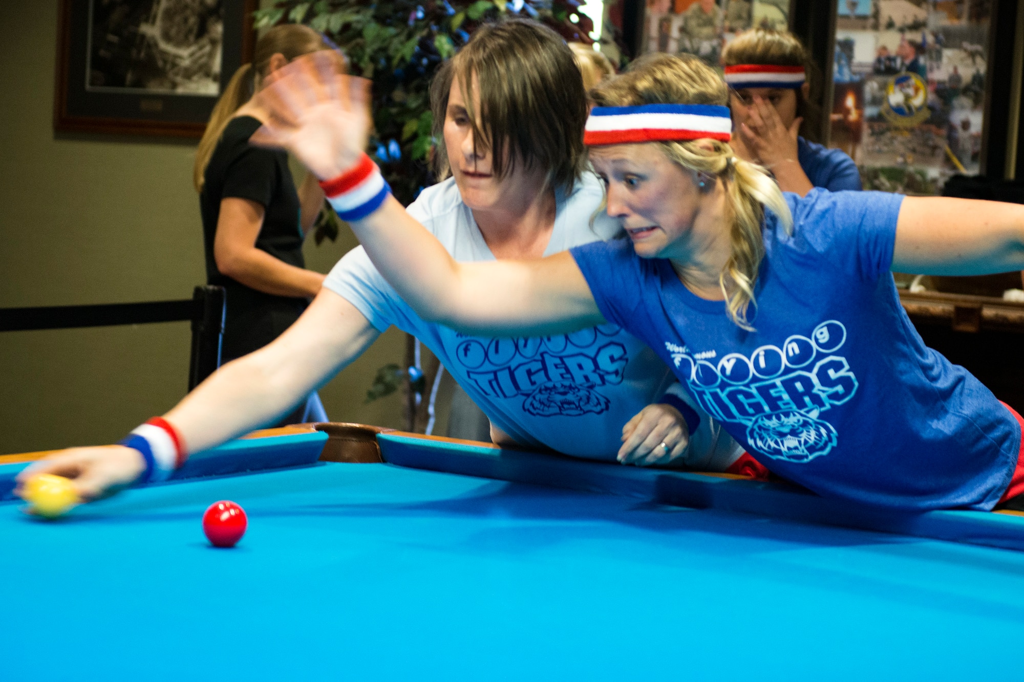 Jessica Seyfried, right, and Jennifer Morash, crud players, engage each other during a spouses crud tourney, April 27, 2018, at Moody Air Force Base, Ga. The Moody spouses built the event around teamwork and comradery, giving them an opportunity to experience a long-held tradition amongst the Air Force fighter and rescue squadrons. Though the game originated in the Royal Canadian Air Force, it has since been adopted by the U.S. (U.S. Air Force photo by Airman 1st Class Erick Requadt)