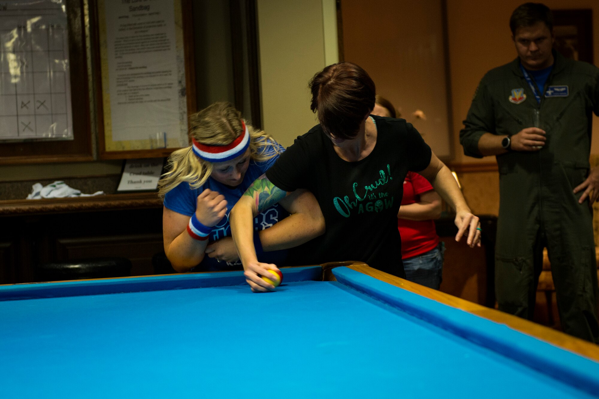Terri Beaudrie, right, and Jessica Seyfried, crud players, engage each other during a spouses crud tourney, April 27, 2018, at Moody Air Force Base, Ga. The Moody spouses built the event around teamwork and comradery, giving them an opportunity to experience a long-held tradition amongst the Air Force fighter and rescue squadrons. Though the game originated in the Royal Canadian Air Force, it has since been adopted by the U.S. (U.S. Air Force photo by Airman 1st Class Erick Requadt)