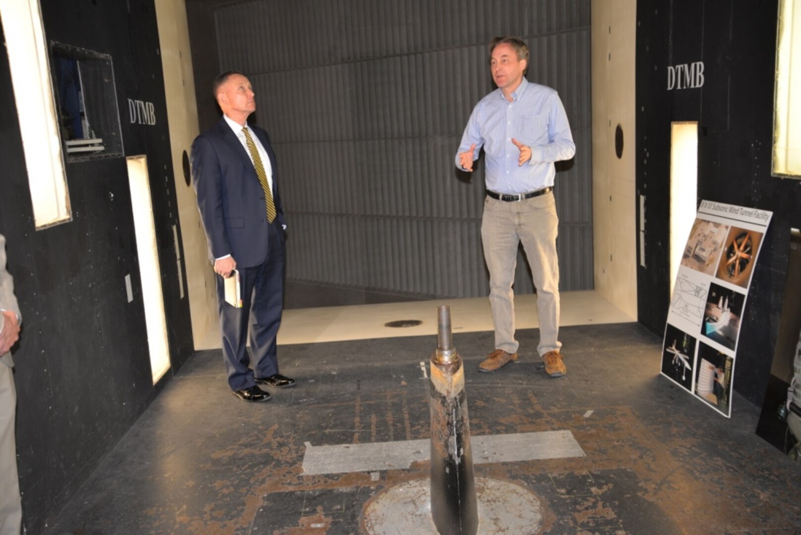 Kevin Kimmel (right), an aerospace engineer in the Sea-Based Aviation and Aeromechanics Branch, explains how the Navy™s largest subsonic wind tunnel works to Deputy Assistant Secretary of the Navy for Unmanned Systems Frank Kelley during a visit to Naval Surface Warfare Center, Carderock Division in West Bethesda, Md., on April 20, 2018. (U.S. Navy photo by Kelley Stirling/Released)