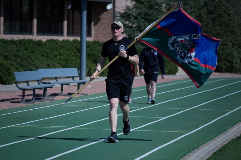 Airmen from the 13th Air Support Operations Squadron completed the 24-hour run challenge in honor of 12 fallen servicemembers at Peterson Air Force Base, Colo., Fitness Center track,