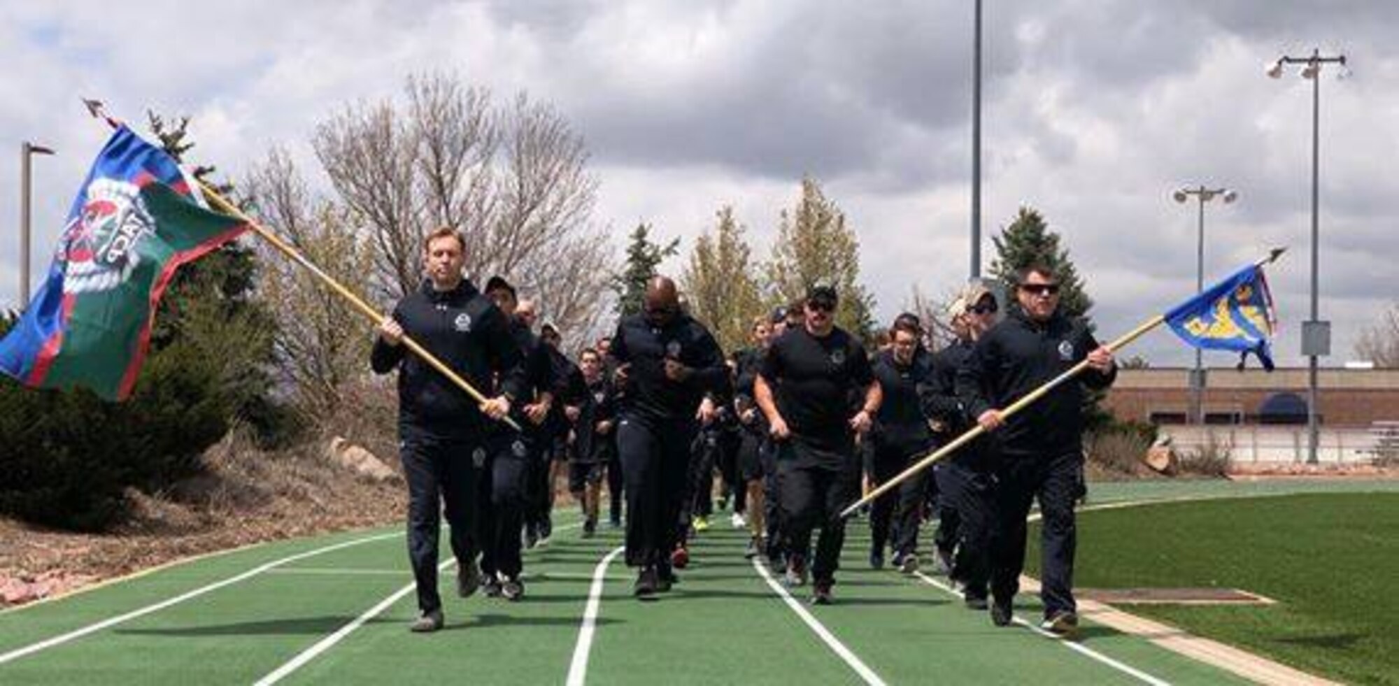 Airmen from the 13th Air Support Operations Squadron completed the 24-hour run challenge in honor of 12 fallen servicemembers at Peterson Air Force Base, Colo., Fitness Center track,