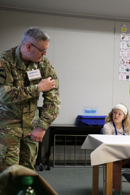 Col. Stephen Bales, U.S. Army Corps of Engineers' Middle East District commander, responds to questions about his uniform and explains significance of specific patches during a recent STARBASE Academy presentation on engineering.
