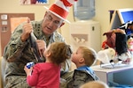 U.S. Air Force Gen. John Hyten, commander of U.S. Strategic Command (USSTRATCOM), reads to children during a visit to Child Development Center (CDC) II at Offutt Air Force Base, Neb., April 26, 2018. Hyten and other USSTRATCOM senior leaders read to children at the CDC in honor of Month of the Military Child, designated in April as a time to honor the sacrifices of the more than 1.7 million children of military members serving globally.