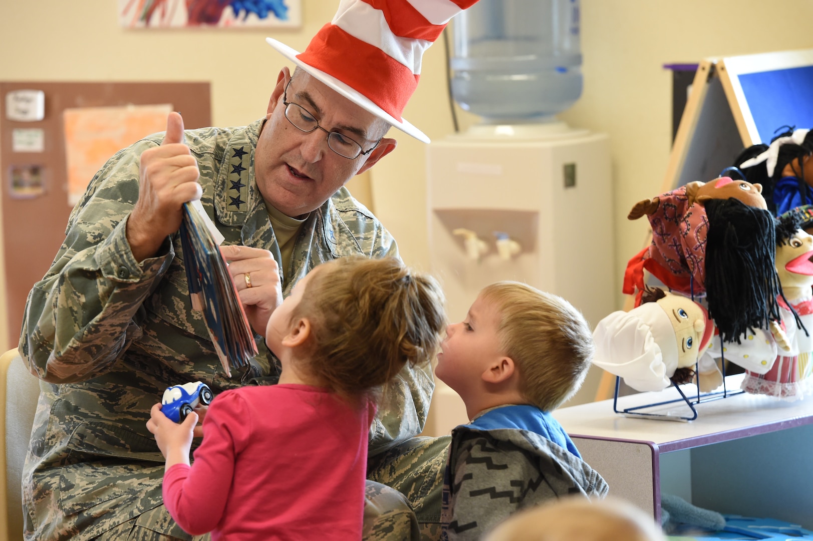 U.S. Air Force Gen. John Hyten, commander of U.S. Strategic Command (USSTRATCOM), reads to children during a visit to Child Development Center (CDC) II at Offutt Air Force Base, Neb., April 26, 2018. Hyten and other USSTRATCOM senior leaders read to children at the CDC in honor of Month of the Military Child, designated in April as a time to honor the sacrifices of the more than 1.7 million children of military members serving globally.
