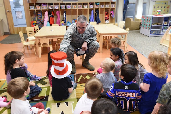 U.S. Air Force Gen. John Hyten, commander of U.S. Strategic Command (USSTRATCOM), shares the Cat in the Hat reading hat before he reads to children at the Child Development Center (CDC) II at Offutt Air Force Base, Neb., April 26, 2018. Hyten and other USSTRATCOM senior leaders read to children at the CDC in honor of Month of the Military Child, designated in April as a time to honor the sacrifices of the more than 1.7 million children of military members serving globally.