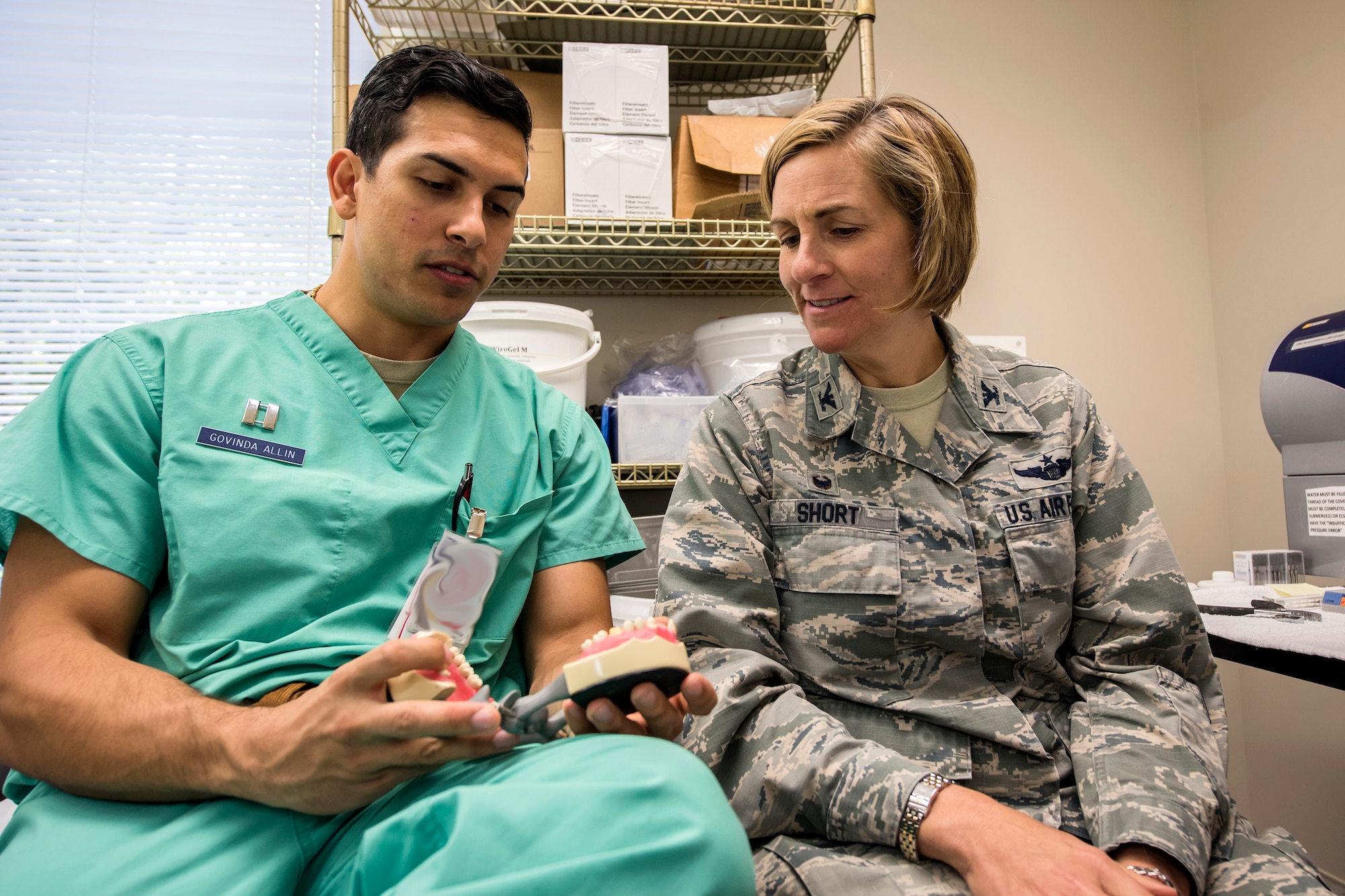 Col. Jennifer Short, right, 23d Wing commander, and Capt. Dr. Govinda Allin, 23d Aerospace Medicine Squadron dentist, inspect a jaw model, April 30, 2018, at Moody Air Force Base, Ga. Short toured the 23d Medical Group (MDG) to gain a better understanding of their overall mission, capabilities, and comprehensive duties, and was able to experience the day-to-day operations of the various units within the 23d MDG, ranging from bioenvironmental to ambulatory care. (U.S. Air Force photo by Airman 1st Class Eugene Oliver)