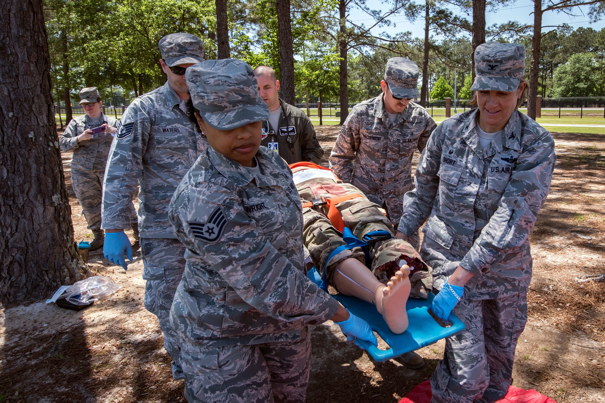 Col. Jennifer Short, right, 23d Wing commander, along with Airmen from the 23d Medical Group (MDG), carry a mannequin, April 30, 2018, at Moody Air Force Base, Ga. Short toured the 23d MDG to gain a better understanding of their overall mission, capabilities, and comprehensive duties, and was able to experience the day-to-day operations of the various units within the 23d MDG, ranging from bioenvironmental to ambulatory care. (U.S. Air Force photo by Airman 1st Class Eugene Oliver)