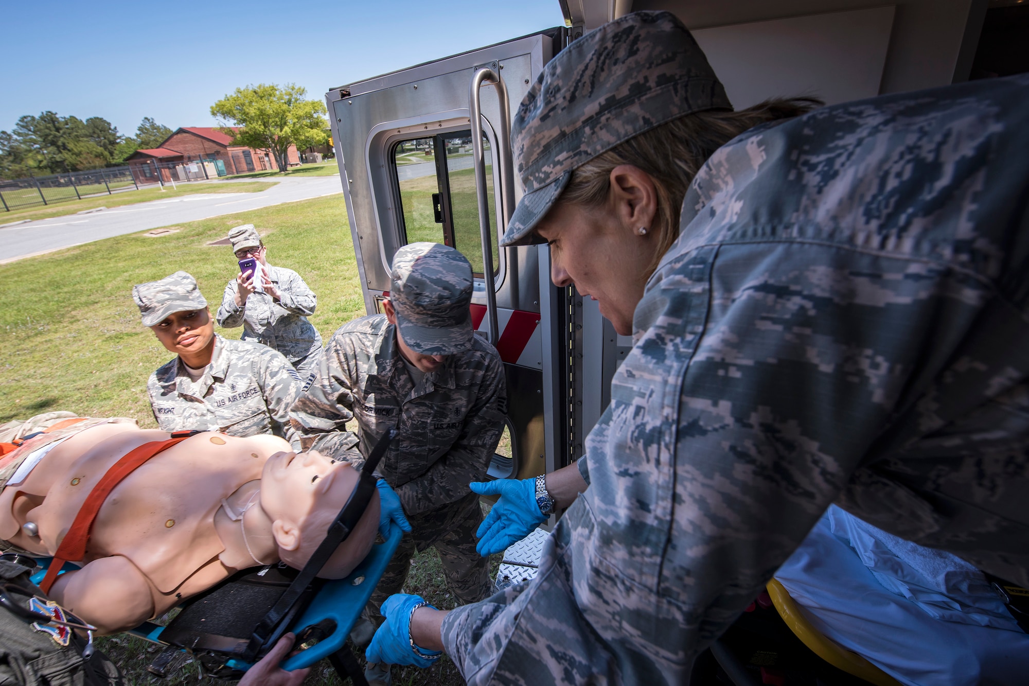 Col. Jennifer Short, right, 23d Wing commander, prepares to receive a gurney holding a mannequin, April 30, 2018, at Moody Air Force Base, Ga. Short toured the 23d Medical Group (MDG) to gain a better understanding of their overall mission, capabilities, and comprehensive duties, and was able to experience the day-to-day operations of the various units within the 23d MDG, ranging from bioenvironmental to ambulatory care. (U.S. Air Force photo by Airman 1st Class Eugene Oliver)