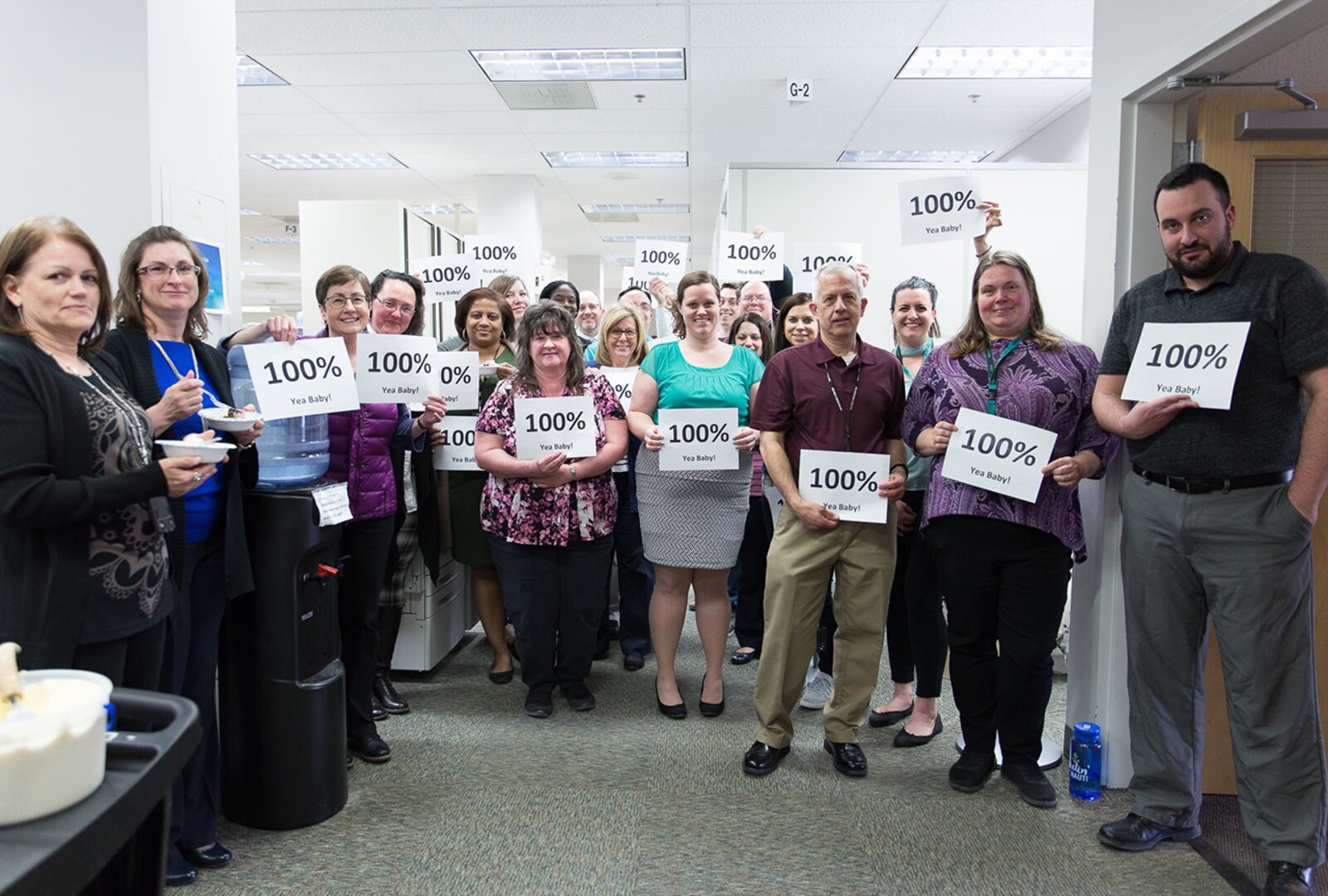 Members of the DLA Maritime Mechanicsburg workforce celebrate 100 percent survey completion.