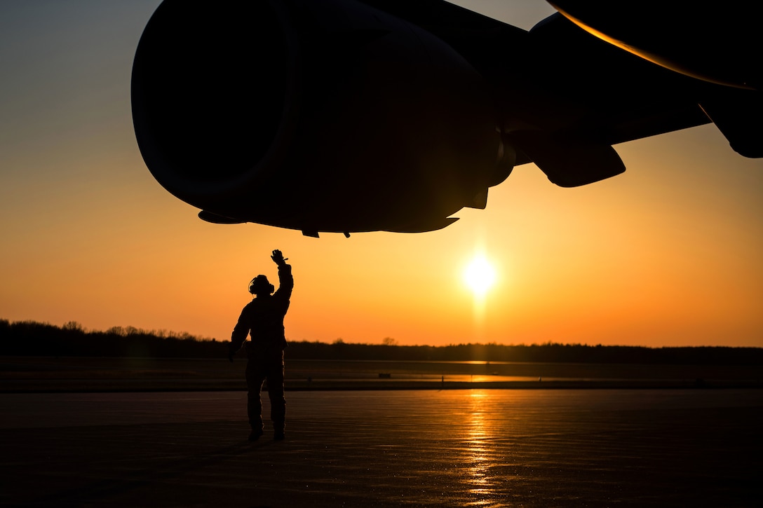 A crew chief performs a postflight inspection on a C-17 Globemaster III.