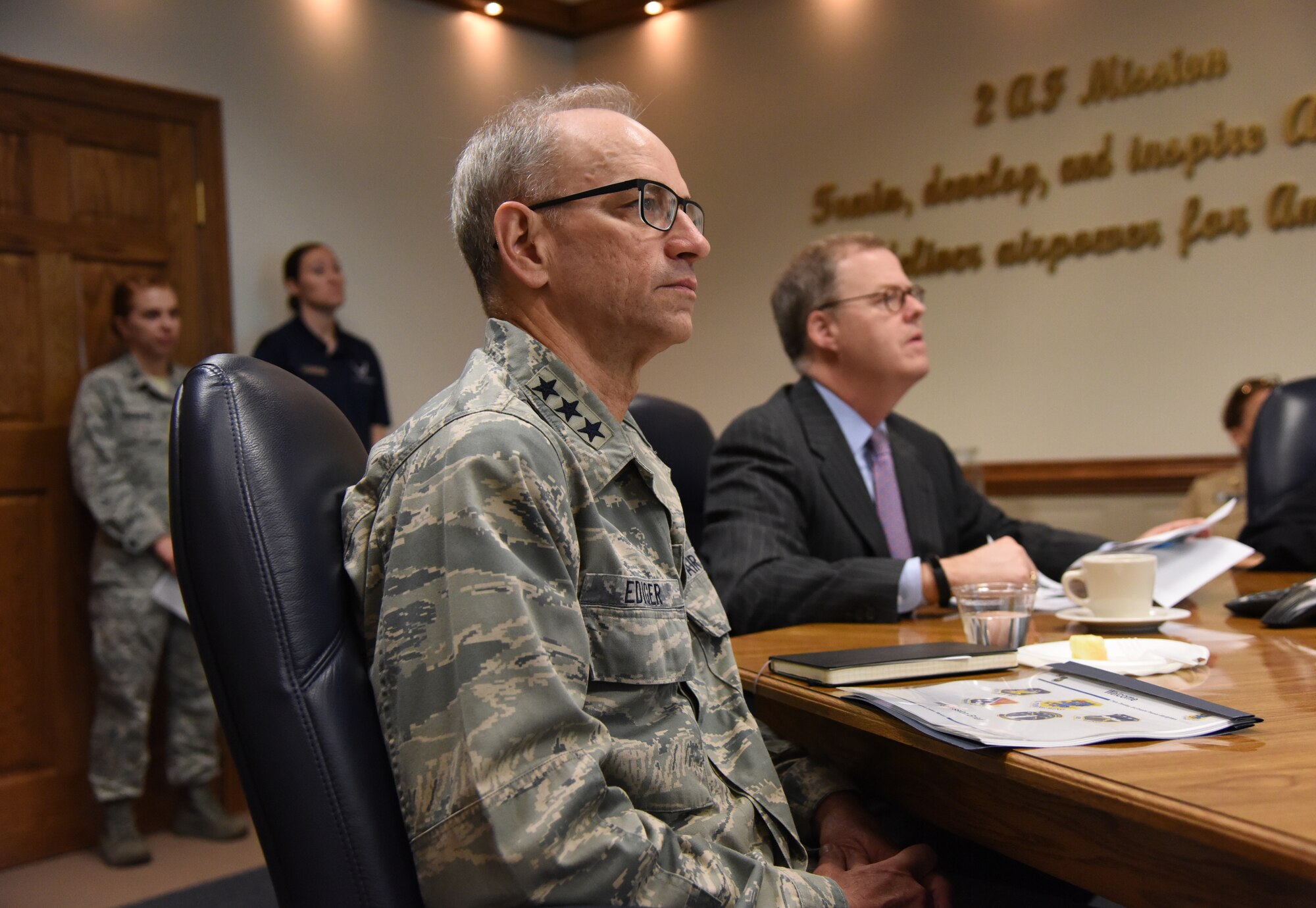 U.S. Air Force Lt. Gen. Mark Ediger, Air Force Surgeon General, and Thomas McCaffery, Acting Assistant Secretary of Defense for Health Affairs, attend the 81st Training Wing mission brief at the 2nd Air Force headquarters building during a site visit at Keesler Air Force Base, Mississippi, April 27, 2018. The purpose of the visit was to get oriented with base operations and the Keesler Medical Center. The visit also included an office call with 2nd AF leadership and tours of the Clinical Research Lab and the newly renovated 81st Dental Squadron clinic. (U.S. Air Force photo by Kemberly Groue)
