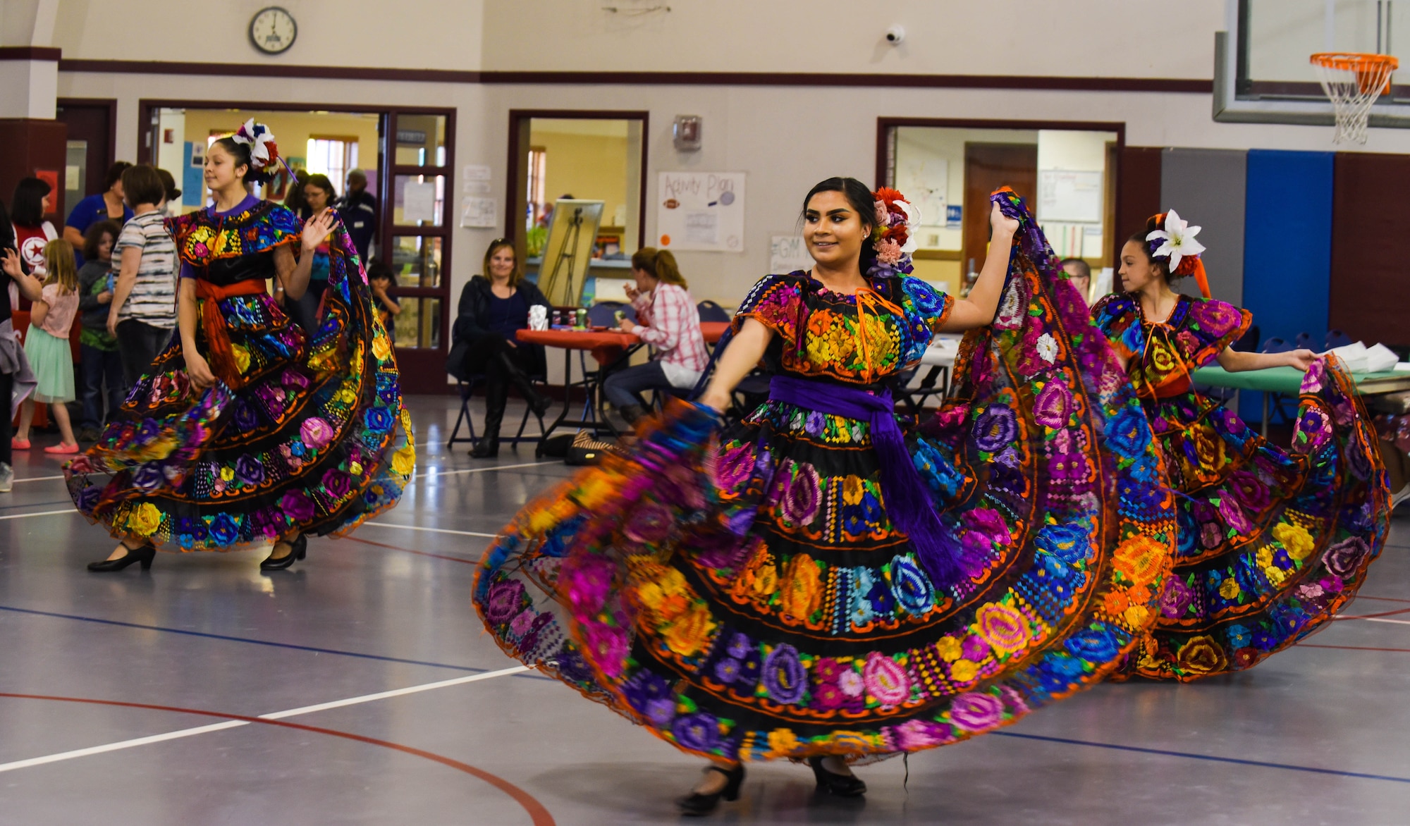 The youth dance group Las Angelitas Unidas y Los Rayos del Sol perform a dance routine during the Month of the Military Child Spring Bash April 27, 2018, on F.E. Warren Air Force Base, Wyo. Las Angelitas Unidas y Los Rayos del Sol is a nonprofit Mexican folkloric dance group dedicated to sharing culture through music and dance. The 90th Force Support Squadron held this spring bash to celebrate the children of military members and what they experience.  (U.S. Air Force photo by Airman 1st Class Braydon Williams)