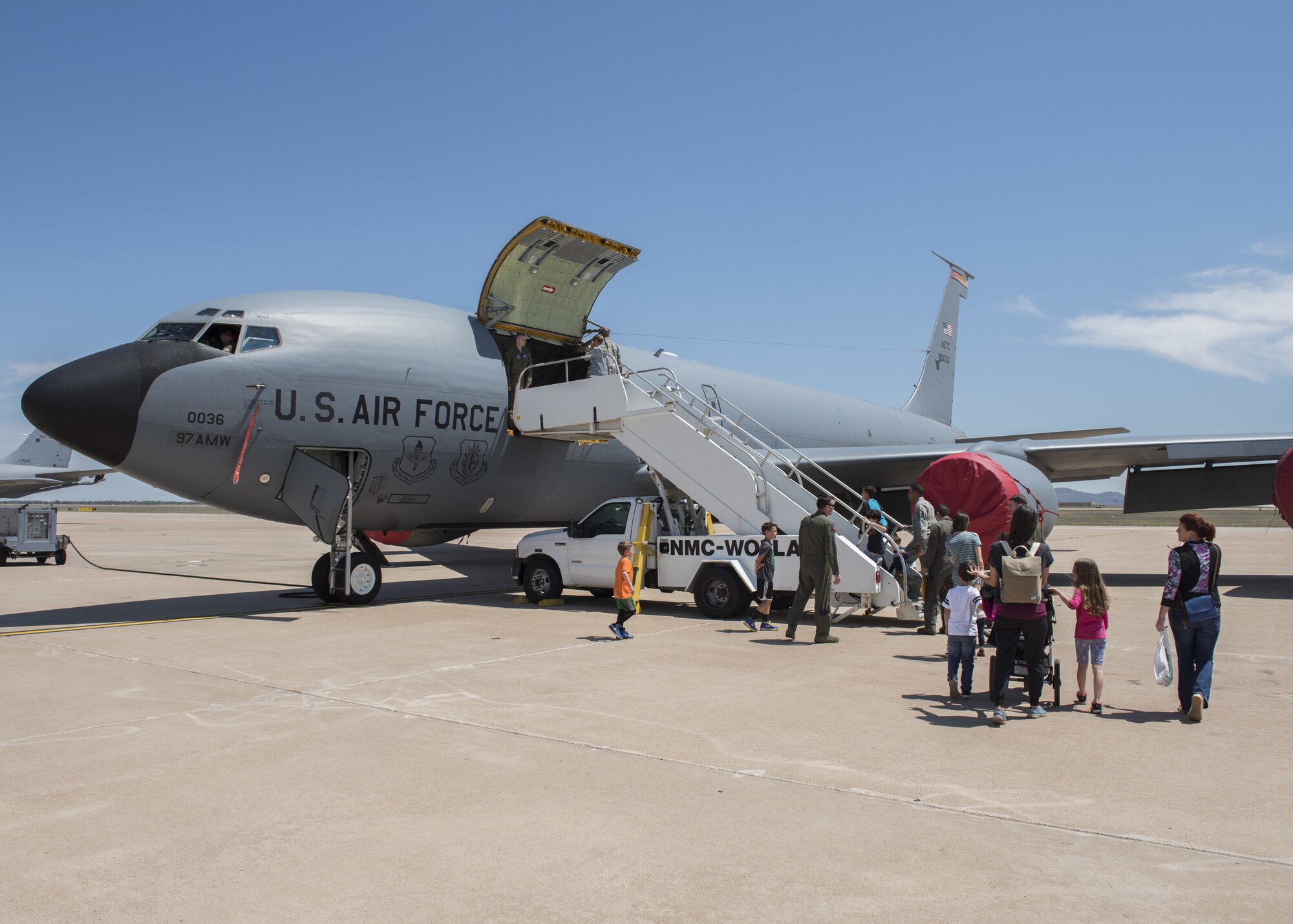 Members of the Operations Group and their families board a KC-135 Stratotanker, April 26, 2018, at Altus Air Force Base, Okla.