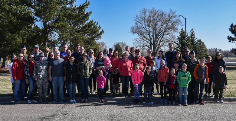 Participants for a family day prepare to leave base and head out to a Missile Alert Facility in the F.E. Warren missile complex on April 28, 2018. The 320th Missile Squadron held this family day in order to equip families with a better understanding of the role their missileer plays while out in the field. (U.S. Air Force photo by Airman 1st Class Abbigayle Wagner)