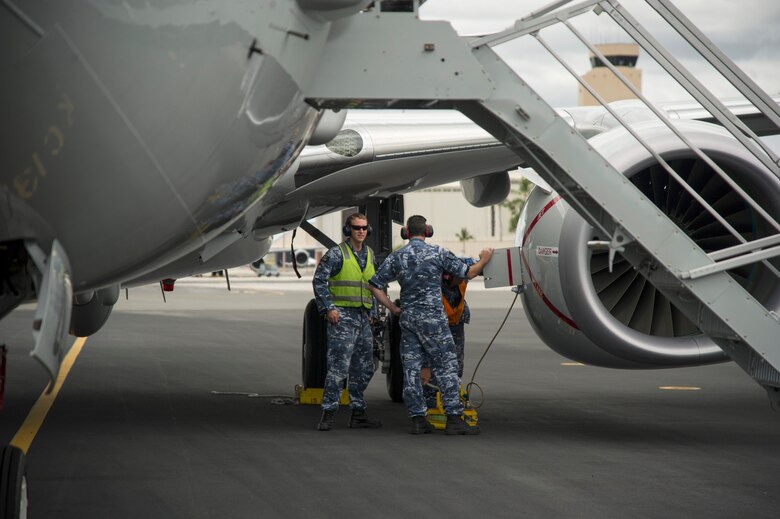 Royal Australian Air Force maintainers secure a P-8A Poseidon, the seventh to be delivered to Australia, after it arrives at Joint Base Pearl Harbor-Hickam, Hawaii, May 1, 2018. The 15th Wing supported the P-8 during its transition to 11 Squadron, RAAF Base Edinburgh, to replace the RAAF’s AP-3C Orion aircraft. (U.S. Air Force photo by Tech. Sgt. Heather Redman)