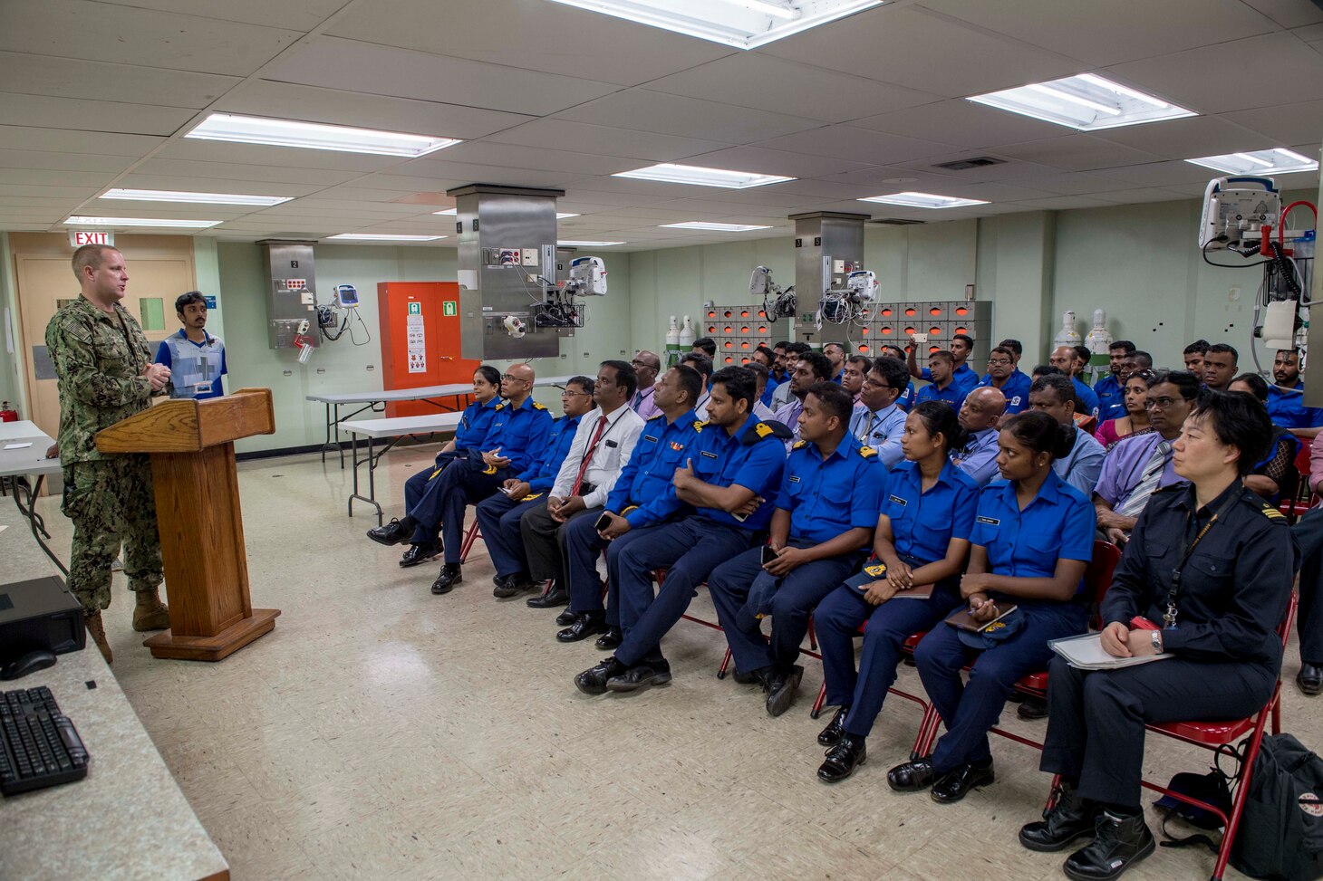 Lt. James Low (left), assigned to Military Sealift Command hospital ship USNS Mercy (T-AH 19) for Pacific Partnership 2018 (PP18), welcomes Sri Lankan oral surgeons and dentists to the dental SMEE aboard Mercy. PP18's mission is to work collectively with host and partner nations to enhance regional interoperability and disaster response capabilities, increase stability and security in the region, and foster new and enduring friendships across the Indo-Pacific Region. Pacific Partnership, now in its 13th iteration, is the largest annual multinational humanitarian assistance and disaster relief preparedness mission conducted in the Indo-Pacific.