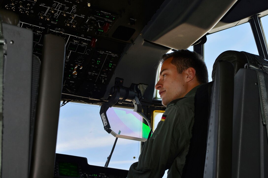 German air force 1st Lt. Felix, sits in the cockpit of a U.S. Air Force C-130J Super Hercules in Berlin, Germany, April 27, 2018. U.S. and German Airmen met with each other to share knowledge and experience concerning their respective aircraft during the 2018 Berlin Air and Trade Show. (U.S. Air Force photo by Senior Airman Joshua Magbanua)