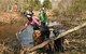 Volunteers remove trash from Shawsheen River