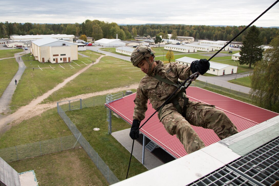 A Soldier with the British army prepares to repel from a tower during exercise Swift Response